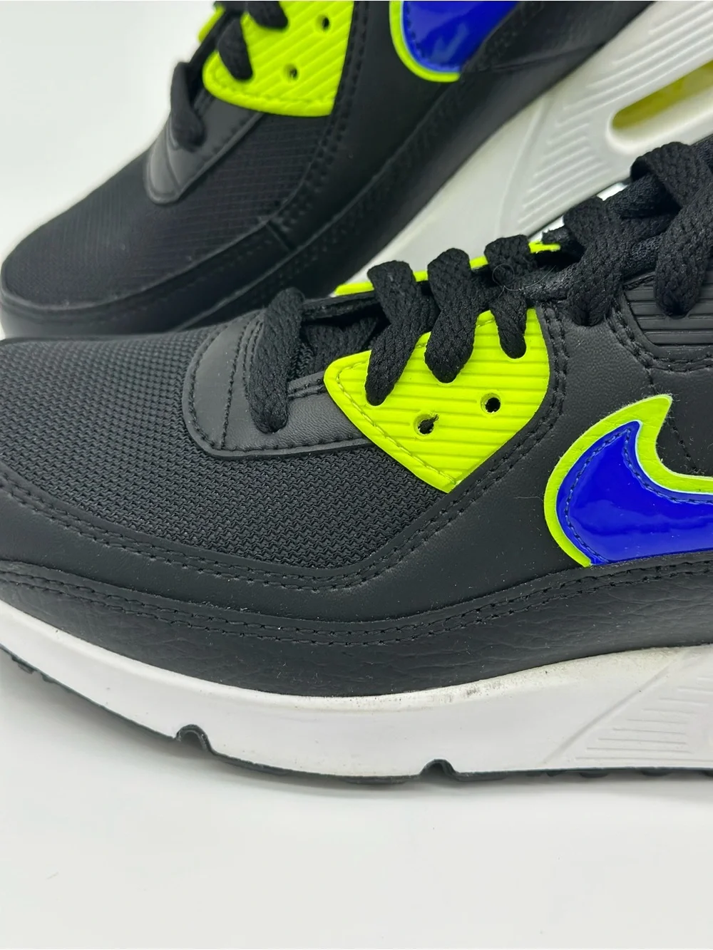 Nike Kids Black Sneakers with Neon Yellow and Blue Swoosh